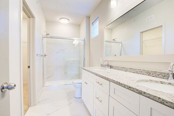 Bathroom with large mirror